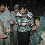 Christians pray for Birgitta Almby outside Jinnah Hospital in Lahore.