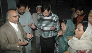 Christians pray for Birgitta Almby outside Jinnah Hospital in Lahore.