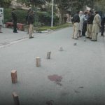 Police inspect site where Christian worker Birgitta Almby was shot in Lahore by suspected Islamic extremists.