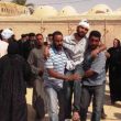 Christians assist a wounded Copt in Al Dabaya outside Luxor, Upper Egypt. (Morning Star News photo)