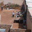 Plain-clothes police enter church building with NISS personnel. (Morning Star News)