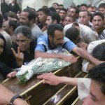 Mourners at funeral for four Copts on July 7, 2013. (Morning Star News photo)
