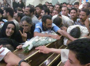 Mourners at funeral for four Copts on July 7, 2013. (Morning Star News photo)