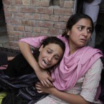 Christian women mourn a dead relative after church bombings in Lahore. (M. Ali)