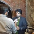 Sarfraz William of Gawahi cable TV channel is interviewed following fire at station office. (Morning Star News via Gawahi Facebook)
