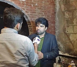 Sarfraz William of Gawahi cable TV channel is interviewed following fire at station office. (Morning Star News via Gawahi Facebook)