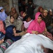 Loved ones keep vigil over the body of Liaqat Masih at home. (Morning Star News)