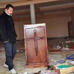 Pastor Mustapha Krireche surveys damage to Light Church in Tizi-Ouzou, Algeria. (Morning Star News)