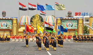 Egyptian soldiers carry flags of branches of the military. (Wikipedia, Egptian military)