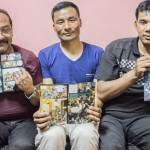 Bimal Shahi, Prakash Pradhan and Shakti Pakhrin, three of eight Christians acquitted, with The Great Story comic book. (CSW, Giulio Paletta)
