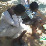 Two daughters, 22 and 17, mourn the death of their father, Yokannah Zirinkuma in Uganda. (Morning Star News)