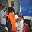 A mother tries to comfort her crying daughter, one of seven children detained at the railway police station in Indore, India, before they were separated. Hindu extremist group leader Vinod Mishra is in blue shirt. (Pawan Bhawar)