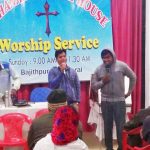Pastor Ajay Kumar (in blue) and a student from Bethany Bible College, in Kerala state, at a prayer service. (Morning Star News)