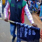 Tribal activist carrying black flag the day before Christmas in Jharkhand state, India. (Morning Star News)