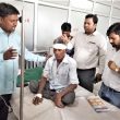 Christian leaders pray for Ram Prasad, wounded in church attack in Uttar Pradesh state, India. (Morning Star News)
