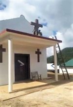 A United Wa State Army (UWSA) militant begins toppling cross on church building in rebel-held territory in Shan state, Burma (Myanmar), in photo circulated on Facebook. (Morning Star News)
