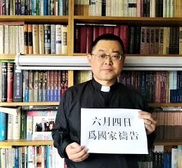 Early Rain Covenant Church pastor Wang Yi poses with sign that reads, 'Pray for the nation on June 4,' the date of the 1989 Tiananmen Square killings. (China Aid)