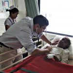Dr. Christo Thomas Philip with heart patient at hospital in Raxaul, Bihar state, India. (Morning Star News)