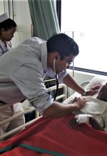 Dr. Christo Thomas Philip with heart patient at hospital in Raxaul, Bihar state, India. (Morning Star News)