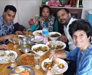 (From left) Pastor Dilli Ram Poudel, Kunsang Tamang, Gaurav Shrivastava and Oleana Cinquanta share a meal in Nepal. (Morning Star News)