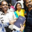 Villagers hand Bible to police in Lalpur as evidence against Christians in Ranchi, Jharkhand state, India. (Morning Star News)