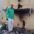 Pastor Anil Juit amid charred debris at church building in Arrah, Bihar state, India. (Morning Star News)