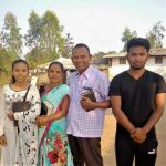 Vijay Kumar Pusuru with family members, whose home in Odisha state, India, was demolished along with his school. (Morning Star News)