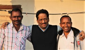 Journalist Anto Akkara with Bijaya Kumar Sanaseth (left) and Gornath Chalanseth. (Morning Star News)