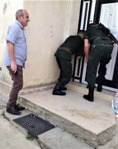 Pastor Messaoud Talkit watches as gendarmes seal church building in Lekhmis village, Algeria on Aug. 6, 2019. (Morning Star News)