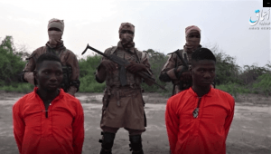 Screen capture from Islamic State’s Amaq news site of Christian aid workers Godfrey Ali Shikagham (left) and Lawrence Duna Dacighir, before their execution by Boko Haram.