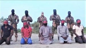 Islamic State in West Africa Province militants before execution of aid workers in Borno, Nigeria. (Screenshot)