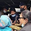 Salamat Mansha Masih (center) sees his mother and attorney (right) on arrival at jail in Lahore on April 23, 2021. (Morning Star News)