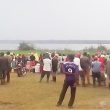 Crowds at Lake Lemwa, Uganda on Sept. 1, 2021 await recovery of the body of Dante Tambika, killed the previous night. (Morning Star News)