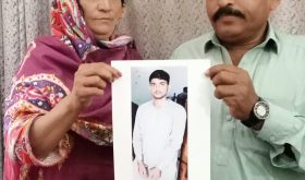 Parents of Noman Masih hold a photograph of their imprisoned son. (Christian Daily International-Morning Star News)