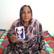 Parveen Shaukat with photo of daughter who was abducted and forcibly converted and married to a Muslim. (Christian Daily International-Morning Star News)