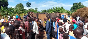 Villagers at charred home where Pastor Mukisa and family were burned to death in Namutumba District, Uganda on Oct. 13, 2024. (Morning Star News)