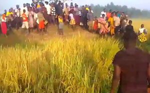 Villagers gather where the body of James Mukenye Habiibu was found on Dec. 17, 2024 in Kibuku District, Uganda. (Morning Star News)