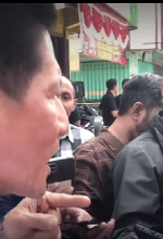 Pastor Herri Soesanto objects to manhandling at sealing of church in Jombang, East Java Province, Indonesia. (Screenshot of YouTube video)