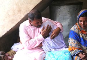 Javed Masih comforts his daughter as he and his wife speak with legal aid group Christians’ True Spirit. (Christian Daily International-Morning Star News courtesy CTS)