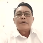 Pastor Novel Pangemanan in video call with rights group about April 14, 2026 halt to construction of prayer house in Kappuna village, North Luwu Regency, Indonesia. (Screenshot from Tanparagi video)